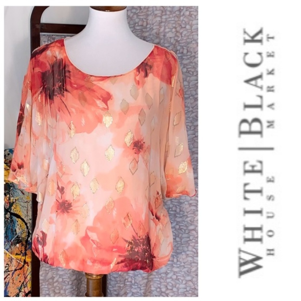 White House Black Market pink peek-a-boo sleeved floral top.